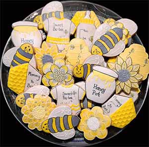 Baby cookie tray: Bees, Honey combs and pots, flowers, and onesies.