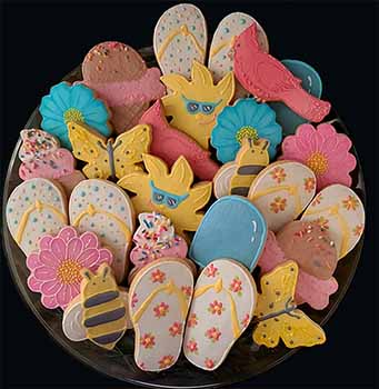 Mother's day cookie tray: Flip flops, suns, butterflies, ice cream cones, bees, flowers, and birds.