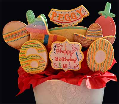 Birthday Cookie Bouquet: Maraca, pinata, chili pepper, sombrero, and numbers.