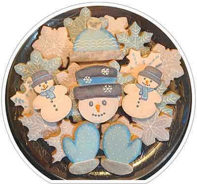 Christmas cookie tray: Snowmen, snow flakes, cap and mittens.