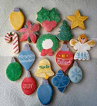 Christmas cookie tray. Lights, ornaments, poinsettia, wreath, tree, lights, holly, angel, candy cane and star.