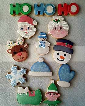 Christmas cookie tray. Ho, Mr and Ms Claus, reindeer, snowmen, cap, mitten, snow, sleigh and elf.