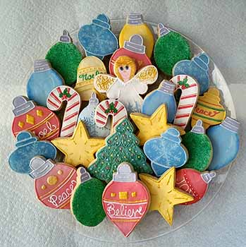 Christmas cookie tray.  Lights, ornaments, tree, lights, and stars.  candy canes. angel.