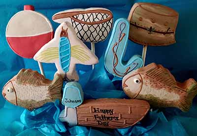 Father's cookie bouquet: Fishing bobber, fly, net, boat, tackle box, fish, hat, and hook. 