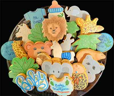 Baby shower cookies: Lion, bear, giraffe, hippo, elephant, bottle, llama, leaves and t shirts.