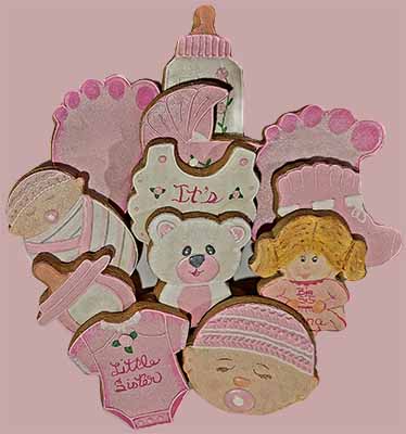 Baby cookies: Baby feet, babies, teddy bear, buggy, baby bootie, bib, bottles and onesie.