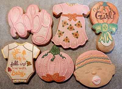 Baby shower cookies: baby, dress, rattle, pumpkin and onsie.