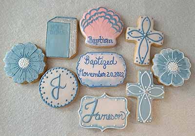 Baptism cookies: Bible, shell, crosses, flowers, and monogram.