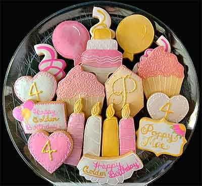 Birthday cookies: Cake, cup cakes, candles, baloons ad hearts.