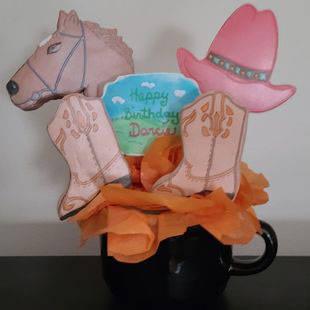 Birthday cookie bouquet: Cowboy hat, boots and horse.