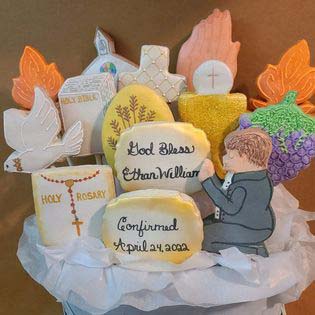 Confirmation cookie bouquet: Bible, church, fire, praying hands, dove, wheat, chalice and communion wafer, grapes, cross, and praying boy.