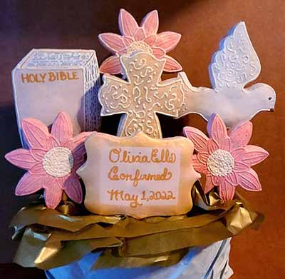 Confirmation cookie bouquet: Bible, Cross, dove, and flowers.