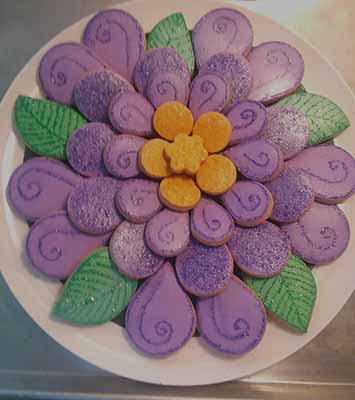 Flower Cookie Tray: Cookies designed and arranged on a plate to form a flower.