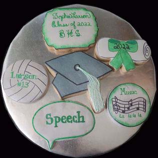 Graduation cookie tray: Volleyball, diploma, hat, speech, music, and date.