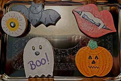 Halloween cookie tray: eye, bat, lips with fangs,ghost, and jack o'lantern.