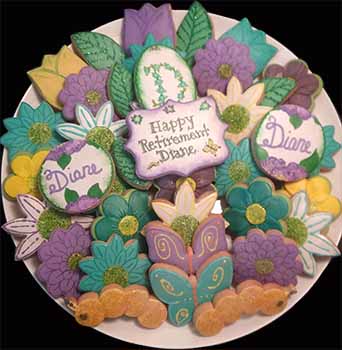 Retirement cookie tray: Flowers, butterfly, and caterpillars.