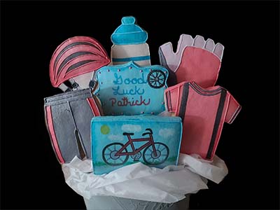 Retirement Cookie Bouquet: Bike helmet, shirt, shorts, gloves, and water bottle.