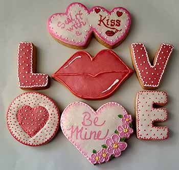 Valentine cookies: Hearts, lips, and spell out love.