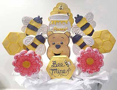 Valetine cookie bouquet: Bees, honey, bear and flowers.