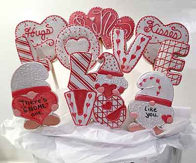 Valentine cookie bouquet: Hearts letters spellig LOVE, and gnomes.