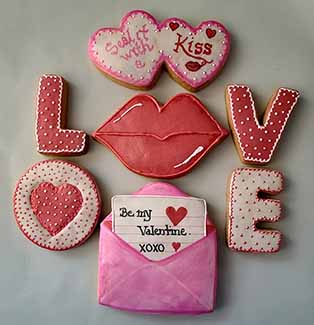 Valentine cookies: Hearts, lips, love letter, and spell out love.