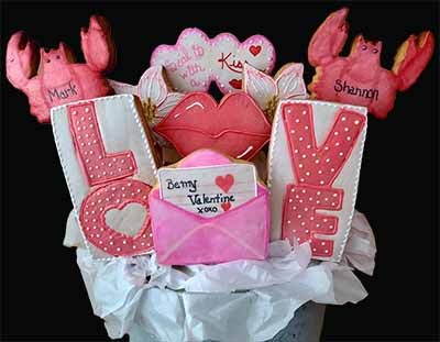 Valentine cookie bouquet: Lobsters, hearts, flowers, lips, spells out LOVE, and a love letter.